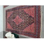 An old Afghan style rug having central diamond shape motif 201cm x 136cm