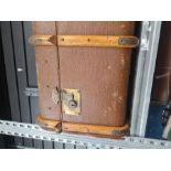 A large wooden bound trunk and a selection of small cases