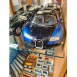 An Autoart 1:12 scale Bugatti Veyron, limited edition with certificate and an Autoart limited editio