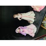 Seven Coalport lady figurines and two Royal Worcester examples (9)