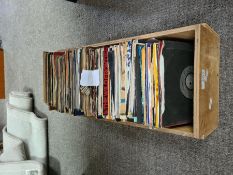 A quantity of 7" singles in wooden crate