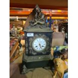 An ornate marble mantle clock having bronze figure of seated boy with gilt metal mounts