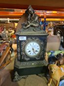An ornate marble mantle clock having bronze figure of seated boy with gilt metal mounts