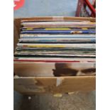 Two boxes of 1980s vinyl 12 inch records