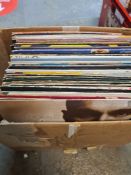 Two boxes of 1980s vinyl 12 inch records