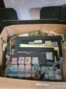 Two small cartons of stamps, some in albums, other in stock cards, GB and Worldwide