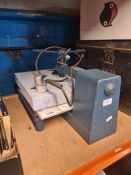 A vintage dry mounting press, a steel deed box and one other