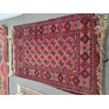 A modern Afghan style rug having repeated design and one other modern Bokara, the largest 181 x 115c