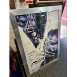 A signed movie poster for Alien v Predator with multiple signatures, two other posters and an illumi