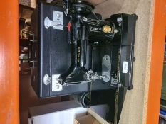 A vintage Singer sewing machine, model 222K, in original fitted, rexine case