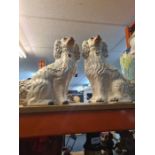 A pair of Staffordshire spaniels and five other Staffordshire items