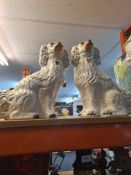 A pair of Staffordshire spaniels and five other Staffordshire items