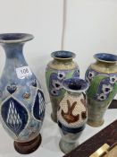 A pair of Doulton Lambeth stoneware vases decorated flowers and two others