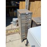 A Bisley metal filing cabinet having 15 drawers, one other metal cabinet with concealed door and sun