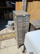 A Bisley metal filing cabinet having 15 drawers, one other metal cabinet with concealed door and sun