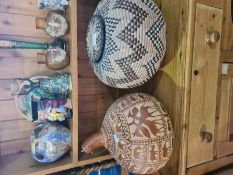 A selection of African straw lidded pots with geometric designs