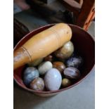 A wooden plant stand, two other wooden items and a quantity of decorative eggs