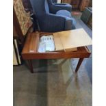 A 1970s mahogany chess coffee table having flip lid with Romanesque chess pieces