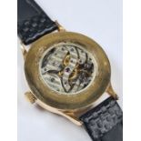 A vintage watch fashioned by a possible Patek Philippe pocket watch movement on leather strap AF, gl