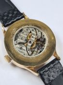 A vintage watch fashioned by a possible Patek Philippe pocket watch movement on leather strap AF, gl