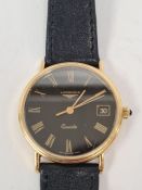 Longines; A gents 18ct gold cased watch with black dial, Roman numerals, date aperture, Quartz movem