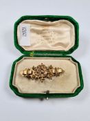 Antique 9ct gold decorative brooch with applied floral and sordling detail, in green velvet H G Hall