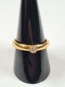22ct yellow gold band ring with single rubover set diamond, size R, marked 22, Londo