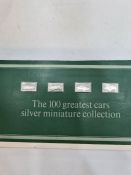 Thirty two of the 100 greatest cars silver miniature collection ingots by John Pinches 1975. In thei