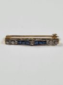 Antique unmarked yellow and white metal bar brooch set with round cut diamonds and graduating Chanel