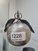 An Italian silver 20th Century silver ornament in the form of an orange with leaves, marked 800. The