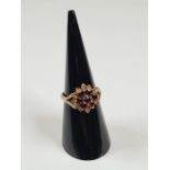 9ct yellow gold garnet set cluster ring, marked 375, size M, maker LM, approx 2.71g