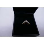 Pretty 18ct yellow gold dress ring set with central diamond, flanked with two baguette cut examples