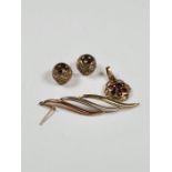 9ct yellow gold pendant set with a garnet, two 9ct gold stoppers and a single 9ct gold drop earring,
