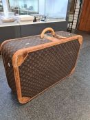 LOUIS VUITTON; a large Louis Vuitton monogram suitcase, late 20th Century, with leather corners, zip
