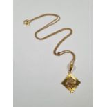 9ct yellow gold neckchain hung with a 9ct gold pendant with filigree design, marked 375, 3.7g approx