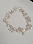 A baroque pearl necklace, approx 44cm with silver loop clasp