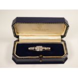 Art Deco diamond set platinum brooch with three central rubover set diamonds, approx 1 carat with tw