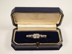 Art Deco diamond set platinum brooch with three central rubover set diamonds, approx 1 carat with tw