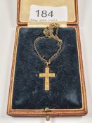 9ct yellow gold cross, marked 9ct AJH, 9ct gold neckchain, AF, marked 375, in brown leather fitted (