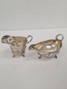 A 18th century creamer having a beaded rim, three hoof feet and a decorative handle, appears to be o