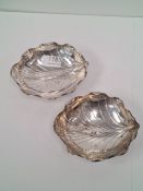 A pair of Chinese bon bon dishes by Luen Hing, early 20th Century, Shanghai, these are in the form o