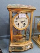 An old onyx and gilt metal 4 glass mantle clock with compensated pendulum