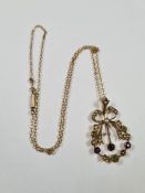 9ct yellow gold fine neckchain hung with an antique pendant in the form of a bowed wreath inset seed