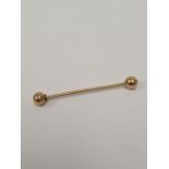 Unmarked yellow gold, probably 9ct Industrial piercing bar with bells, 1.64g approx, 4.5cm