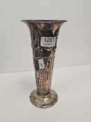 A tall silver Edwardian vase by Atkin Brothers having embossed garland and bows. The raised circular