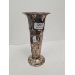 A tall silver Edwardian vase by Atkin Brothers having embossed garland and bows. The raised circular