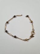 9ct yellow gold bracelet of loop and ball design, AF, broken, marks worn, approx 3.24g