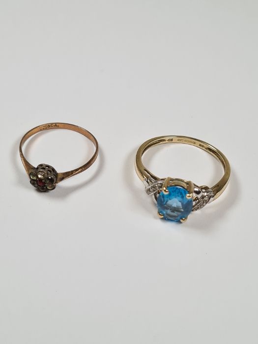 9ct yellow gold dress ring, with oval blue topaz, and diamond chips to the shoulders, size W, togeth - Image 2 of 2