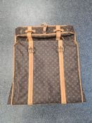LOUIS VUITTON; a Louis Vuitton garment bag, monogram canvas, with straps, zipped compartments, addre