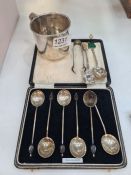 A Thomas Smily silver Victorian spoon hallmarked London 1865, another spoon, a pair of tongs having